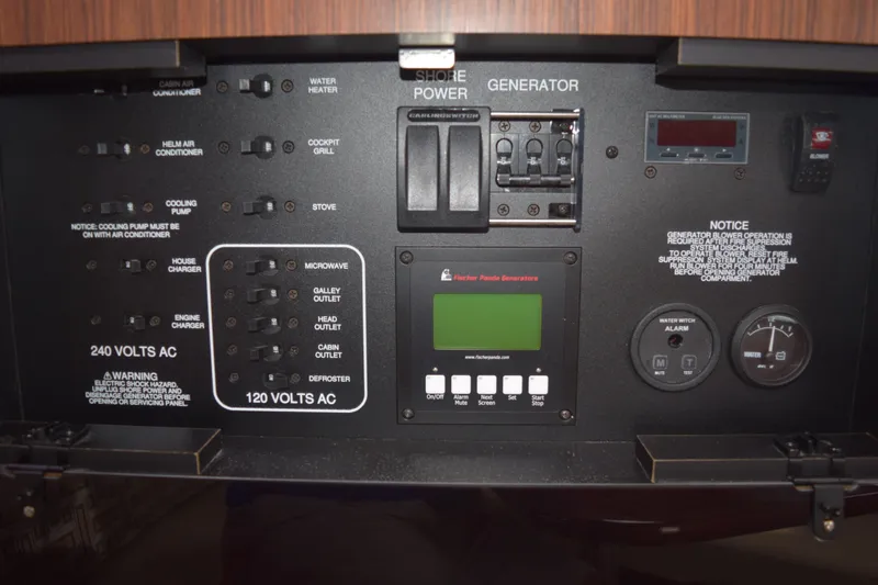  Yacht Photos Pics Electrical control panel of 2022 Pursuit OS 355 Offshore boat with various switches and gauges.