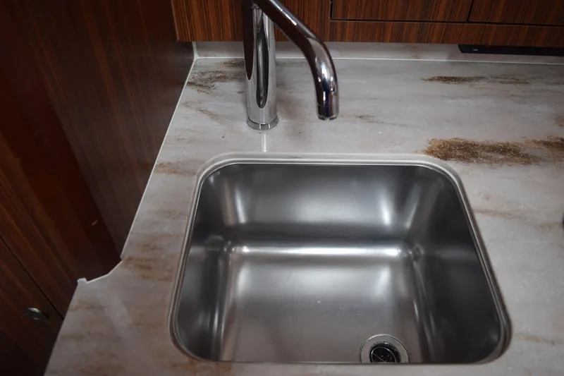  Yacht Photos Pics Stainless steel sink and faucet in 2022 Pursuit OS 355 Offshore boat kitchen.