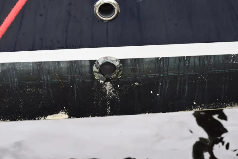  Yacht Photos Pics 2022 Pursuit OS 355 Offshore boat hull with visible waterline and fittings.