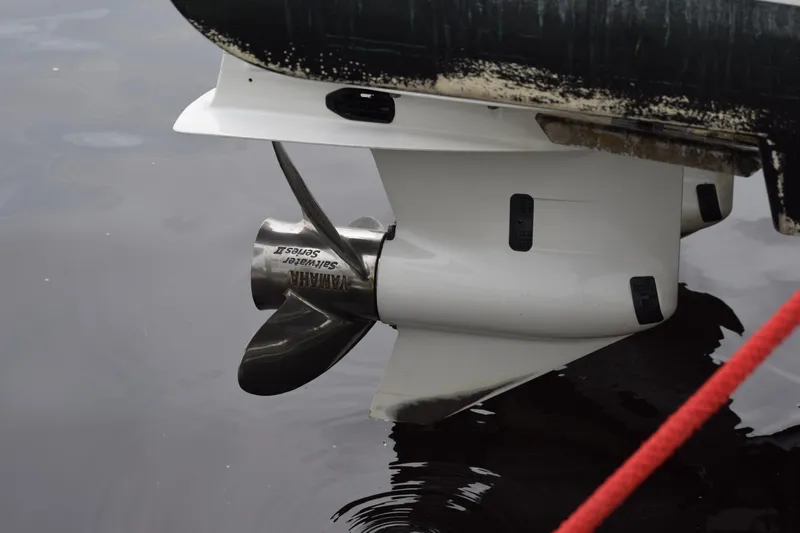  Yacht Photos Pics Propeller of 2022 Pursuit OS 355 Offshore boat in water, close-up view.