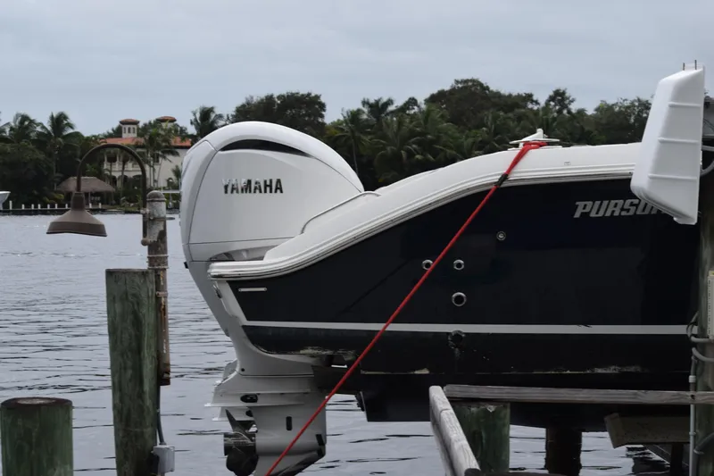  Yacht Photos Pics 2022 Pursuit OS 355 Offshore boat with Yamaha engine docked by waterfront.