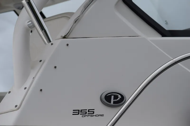  Yacht Photos Pics 2022 Pursuit OS 355 Offshore boat detail with logo and sleek design.
