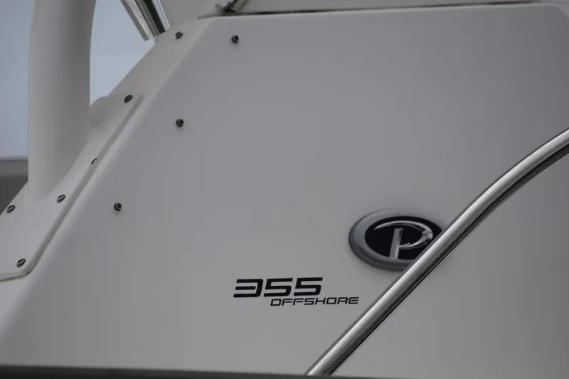  Yacht Photos Pics 2022 Pursuit OS 355 Offshore boat detail with logo and model name.