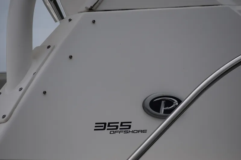  Yacht Photos Pics 2022 Pursuit OS 355 Offshore boat detail with logo and model name.