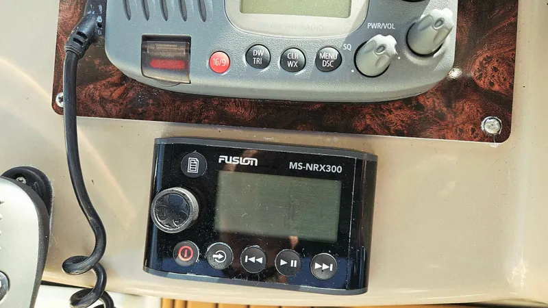  Yacht Photos Pics Control panel on a 2003 Sea Ray 340 Sundancer boat, featuring radio and Fusion MS-NRX300.