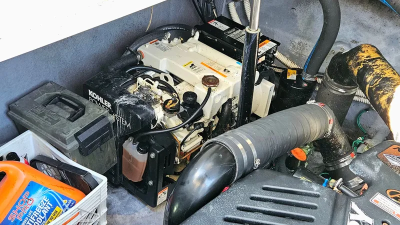  Yacht Photos Pics Engine compartment of a 2003 Sea Ray 340 Sundancer with Kohler power system and maintenance supplies.