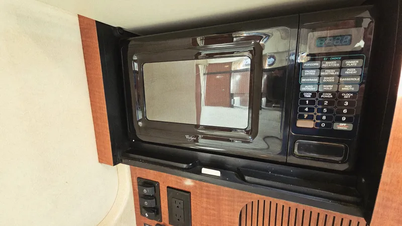  Yacht Photos Pics Microwave in 2003 Sea Ray 340 Sundancer yacht interior kitchen area.