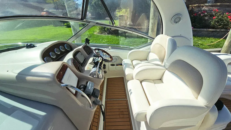  Yacht Photos Pics 2003 Sea Ray 340 Sundancer cockpit with plush seating and modern controls.
