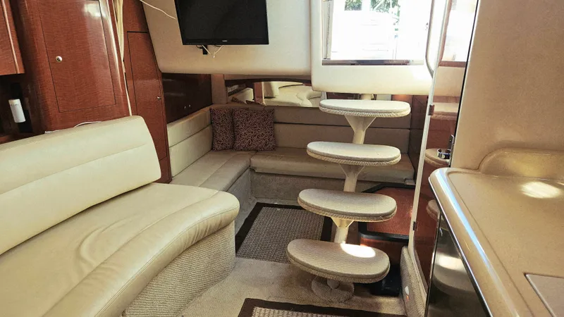  Yacht Photos Pics Interior of 2003 Sea Ray 340 Sundancer yacht with beige seating and modern design.
