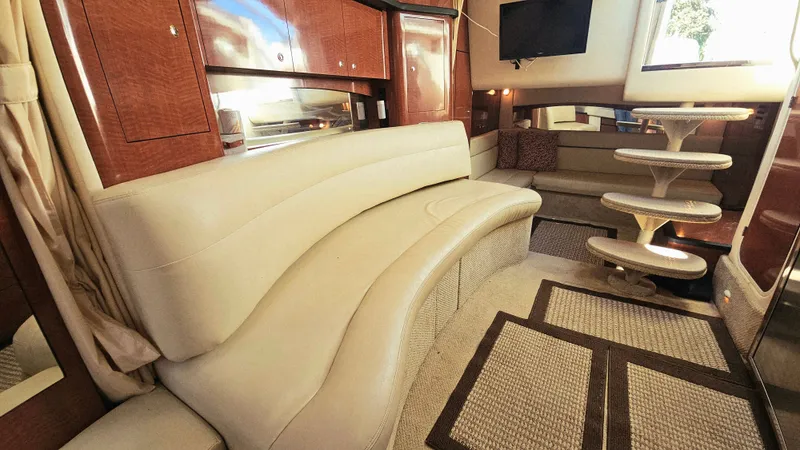  Yacht Photos Pics Luxurious interior of 2003 Sea Ray 340 Sundancer yacht with plush seating and elegant wood finishes.