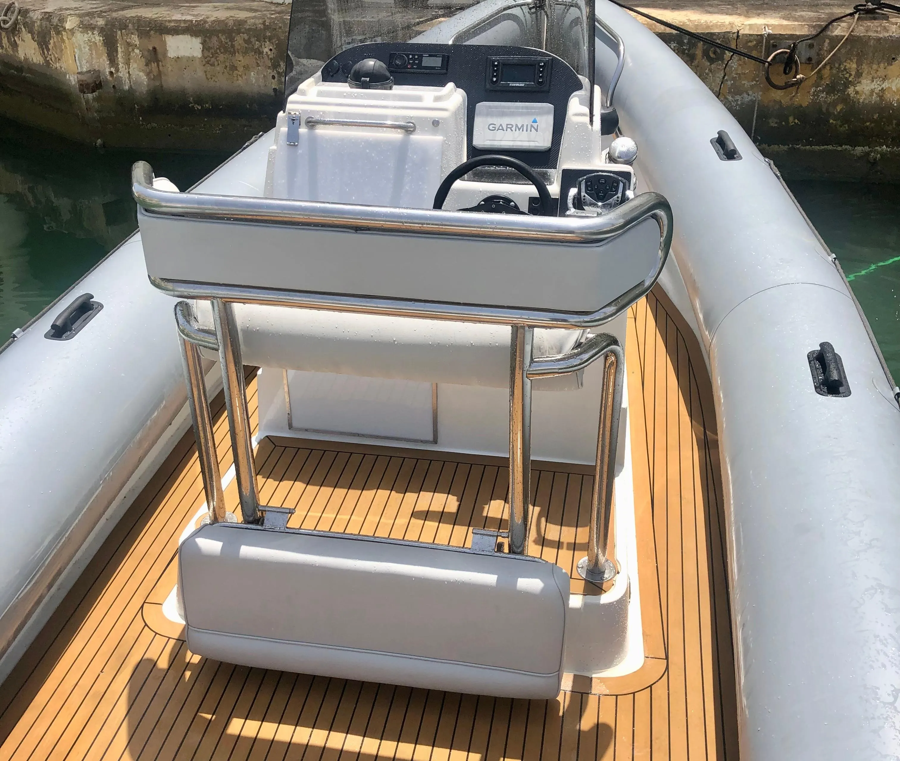 2005 Protector RIB 8.75m boat with wooden deck and modern console.