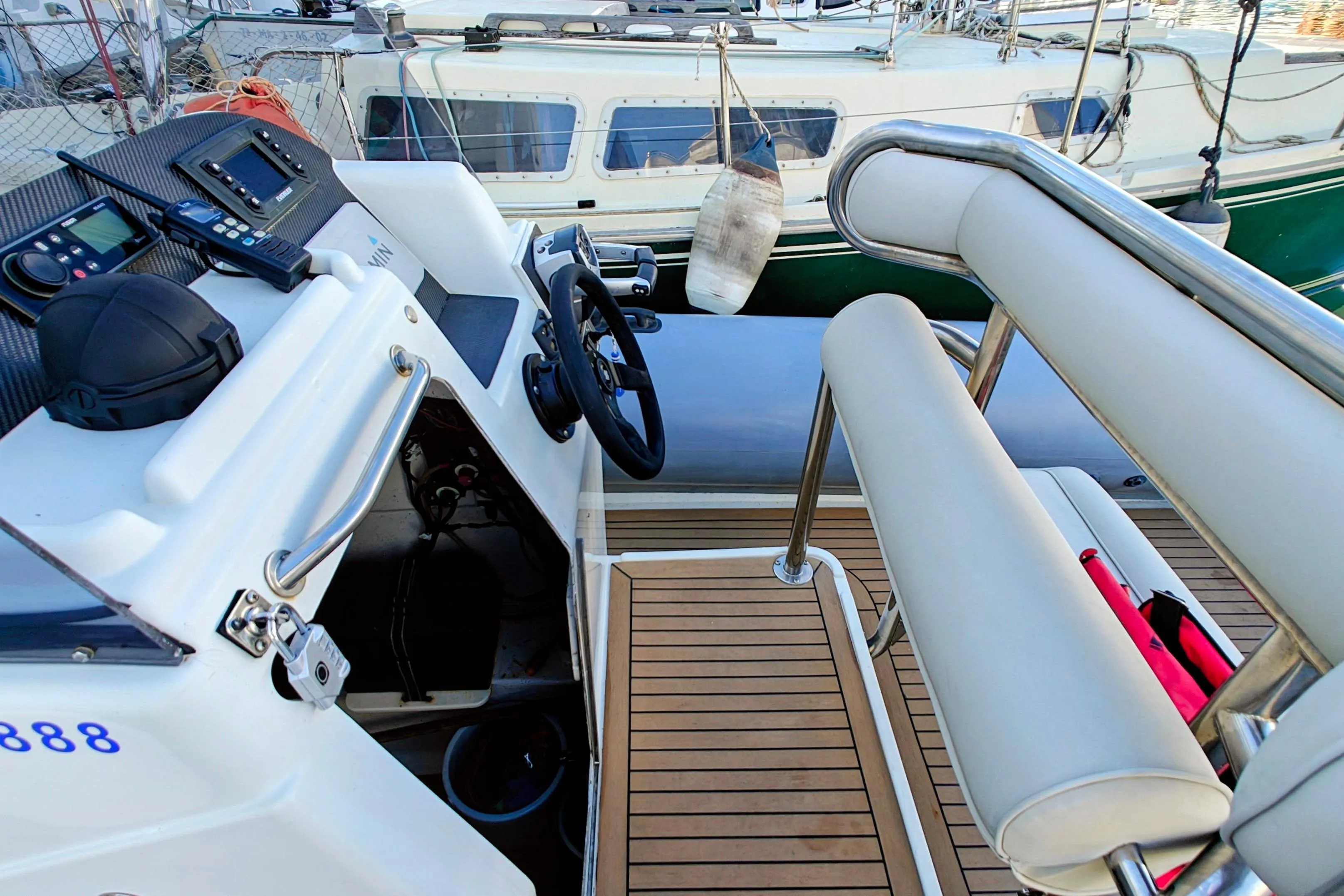 2005 Protector RIB 8.75m boat interior with steering wheel and navigation equipment.