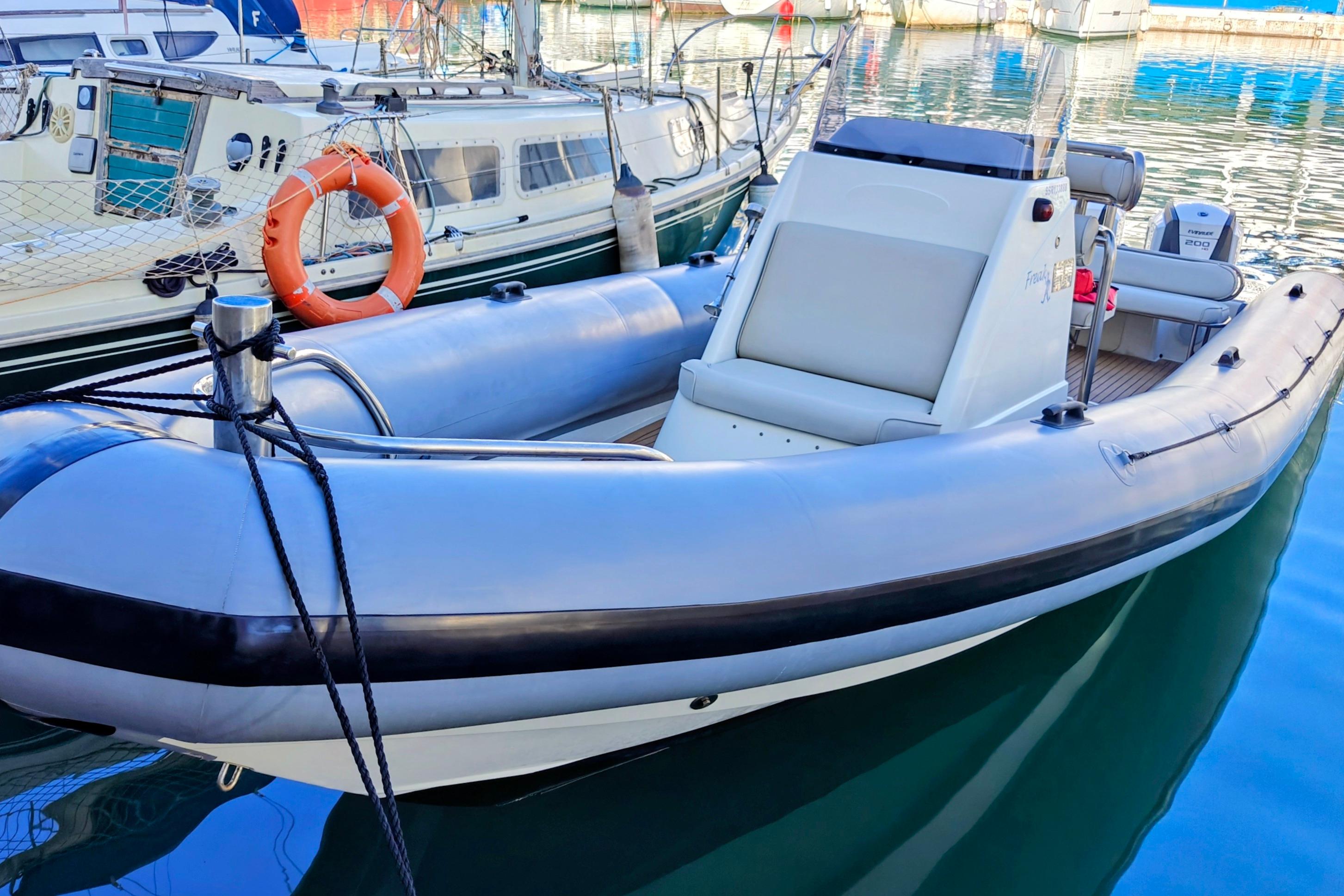 2005 Protector RIB 8.75m boat docked in a marina, featuring sleek design and modern equipment.