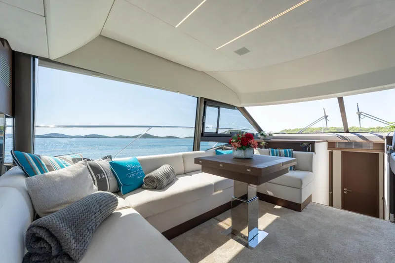 The Sun Yacht Photos Pics Luxurious interior of 2020 Prestige 590 yacht with panoramic ocean view.