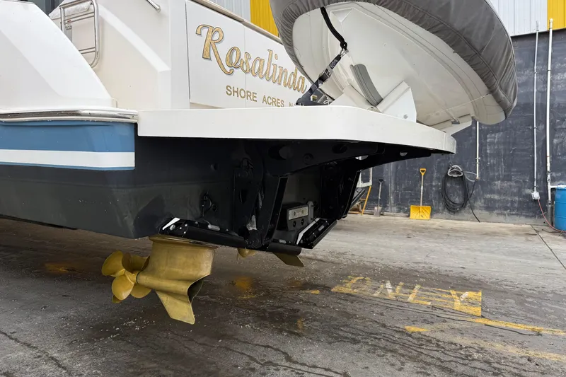 Rosalinda Yacht Photos Pics 2015 Tiara Yachts C44 Coupe rear view with propeller and swim platform.