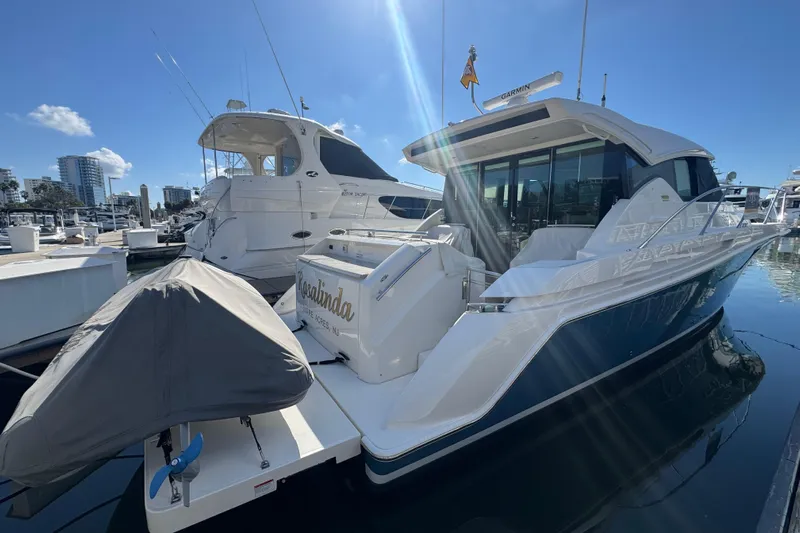 Rosalinda Yacht Photos Pics 2015 Tiara Yachts C44 Coupe docked at marina under clear blue sky.