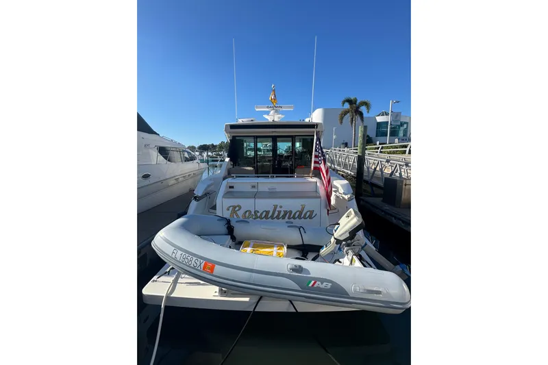 Rosalinda Yacht Photos Pics 2015 Tiara Yachts C44 Coupe docked with inflatable boat and American flag.