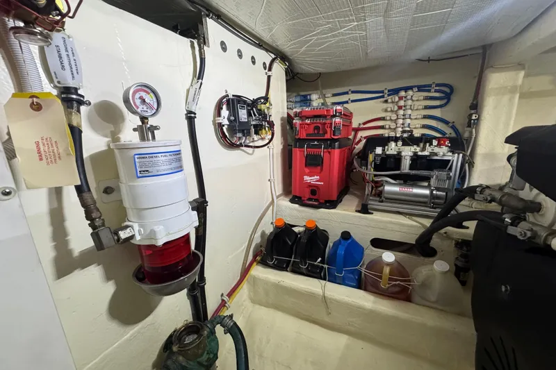Rosalinda Yacht Photos Pics Engine room of 2015 Tiara Yachts C44 Coupe with fuel filter and equipment.