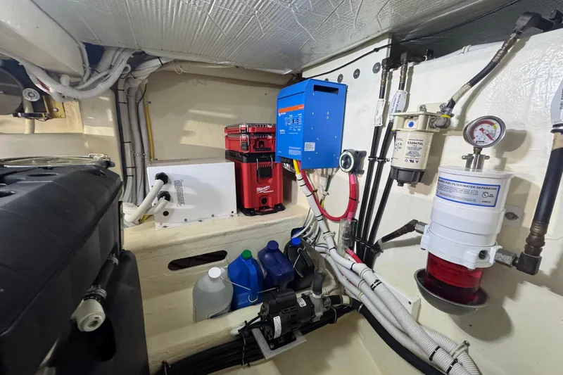 Rosalinda Yacht Photos Pics Engine room of 2015 Tiara Yachts C44 Coupe with equipment and wiring.