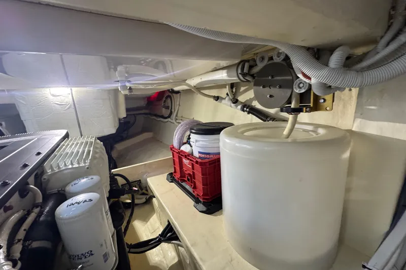 Rosalinda Yacht Photos Pics Engine room of 2015 Tiara Yachts C44 Coupe, showcasing mechanical components and storage.