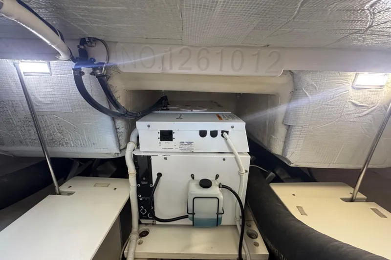 Rosalinda Yacht Photos Pics Engine room of a 2015 Tiara Yachts C44 Coupe, featuring mechanical components and wiring.