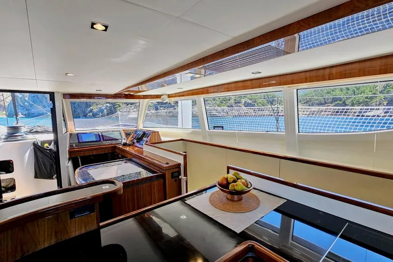  Yacht Photos Pics Luxurious interior of 2016 HH Catamarans HH66 with panoramic windows and modern design.