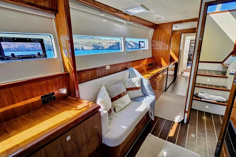 Yacht Photos Pics Luxurious interior of 2016 HH Catamarans HH66 with wood finish and scenic windows.