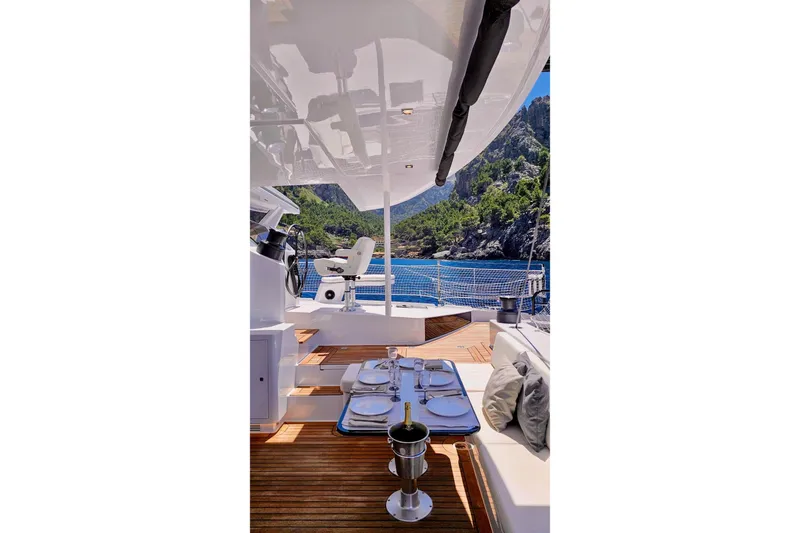  Yacht Photos Pics Luxurious 2016 HH Catamarans HH66 yacht interior with scenic ocean and mountain view.