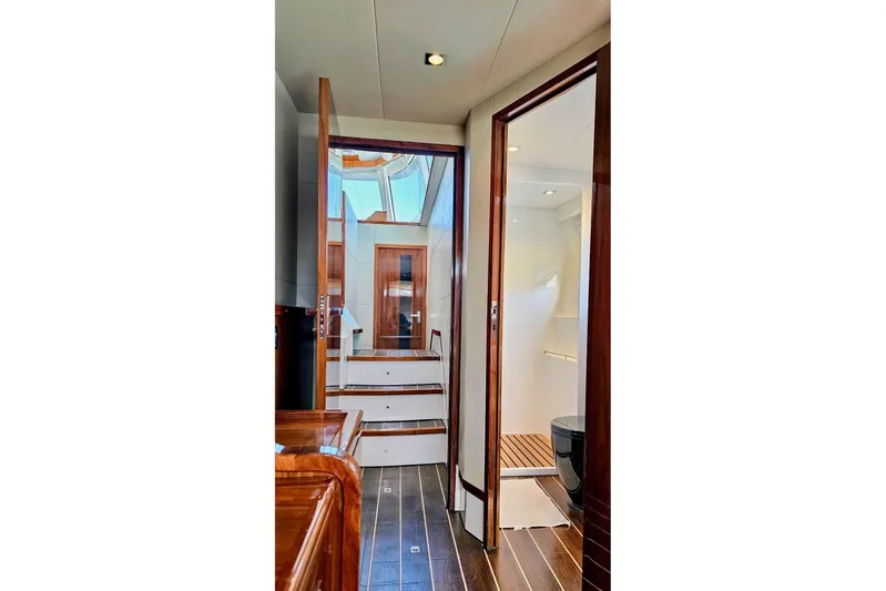  Yacht Photos Pics Luxurious interior of 2016 HH Catamarans HH66, featuring elegant wood finishes and modern design.