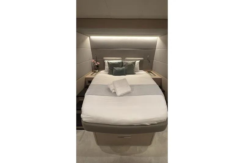 Va Bene Yacht Photos Pics Luxurious bedroom interior of 2022 Lagoon 55 yacht with modern design and ambient lighting.