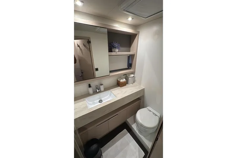 Va Bene Yacht Photos Pics Modern bathroom in 2022 Lagoon 55 yacht with sleek sink and toilet.