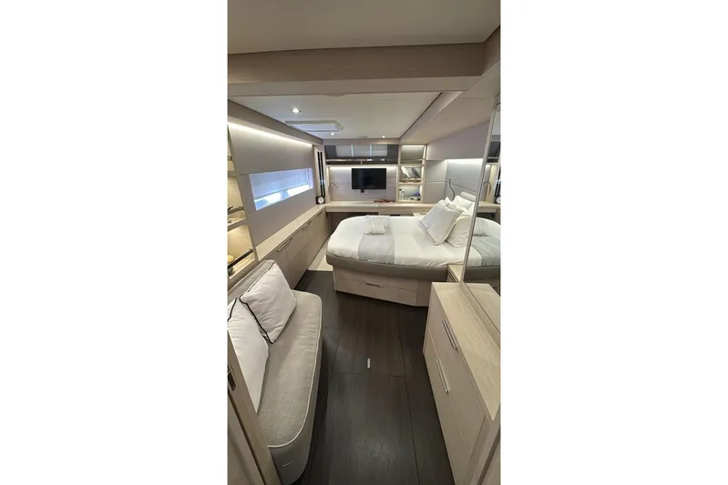 Va Bene Yacht Photos Pics Luxurious interior of 2022 Lagoon 55 yacht with modern bedroom design and elegant furnishings.