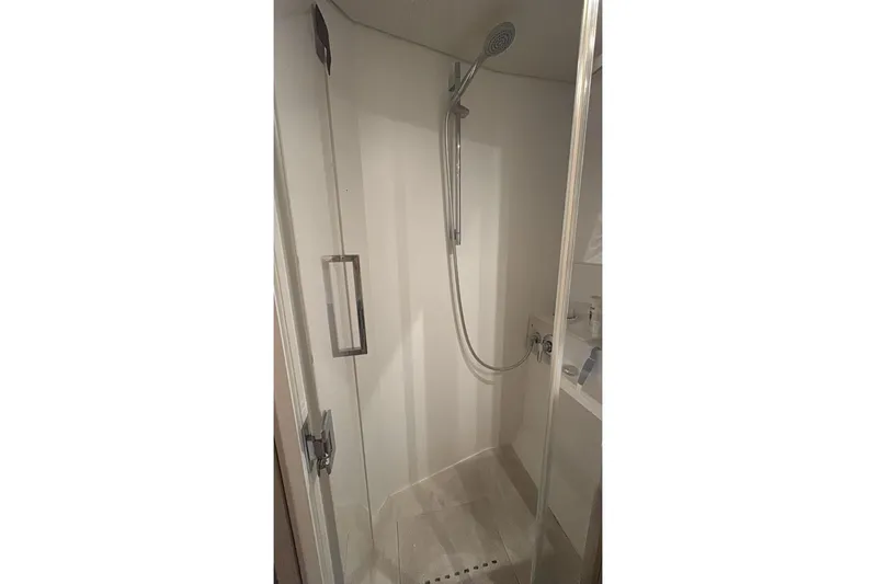 Va Bene Yacht Photos Pics Shower area in 2022 Lagoon 55 yacht, featuring modern fixtures and sleek design.