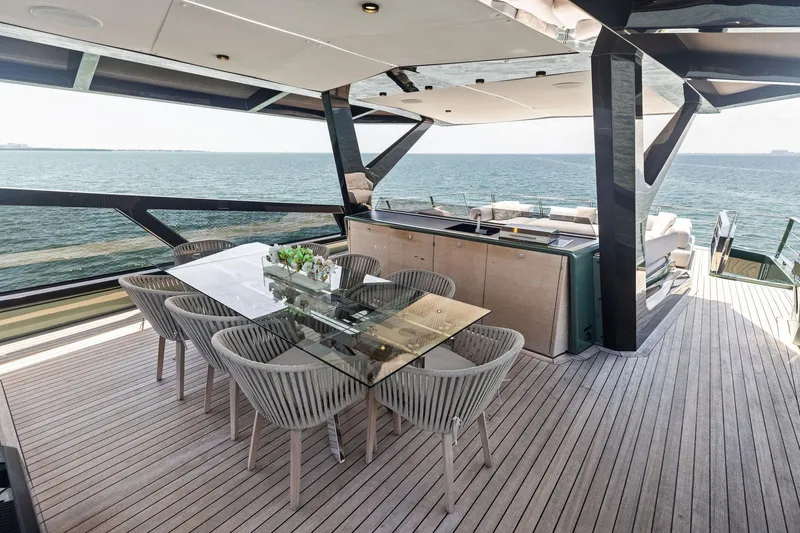 Matzu II Yacht Photos Pics Luxurious 2023 Wally WHY 150 yacht deck with elegant dining area and ocean view.
