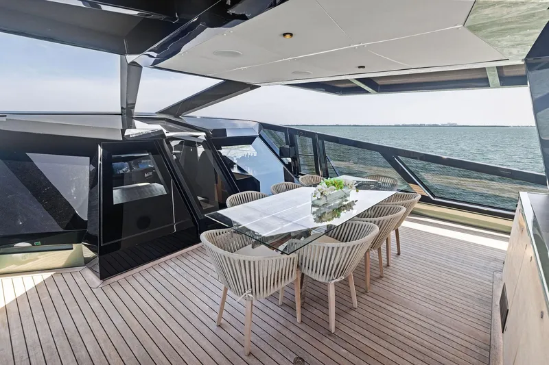 Matzu II Yacht Photos Pics Luxurious 2023 Wally WHY 150 yacht with elegant outdoor dining area and ocean view.