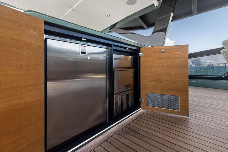 Matzu II Yacht Photos Pics Open storage compartment on 2023 Wally WHY 150 yacht, featuring stainless steel appliances.