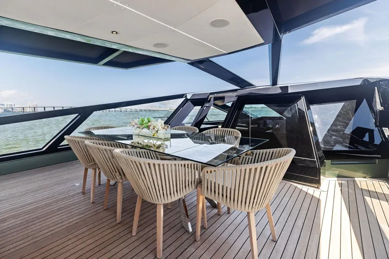 Matzu II Yacht Photos Pics Luxurious 2023 Wally WHY 150 yacht deck with elegant dining area and panoramic views.