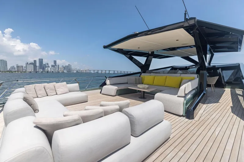 Matzu II Yacht Photos Pics Luxurious 2023 Wally WHY 150 yacht deck with modern seating and city skyline view.