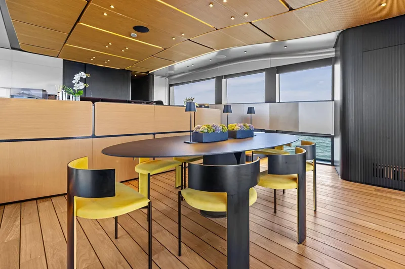 Matzu II Yacht Photos Pics Luxurious interior of 2023 Wally WHY 150 yacht with modern dining area and ocean view.