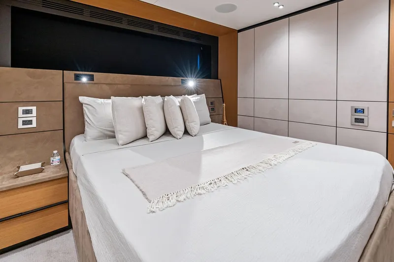 Matzu II Yacht Photos Pics Luxurious bedroom interior on 2023 Wally WHY 150 yacht, featuring modern design and plush bedding.