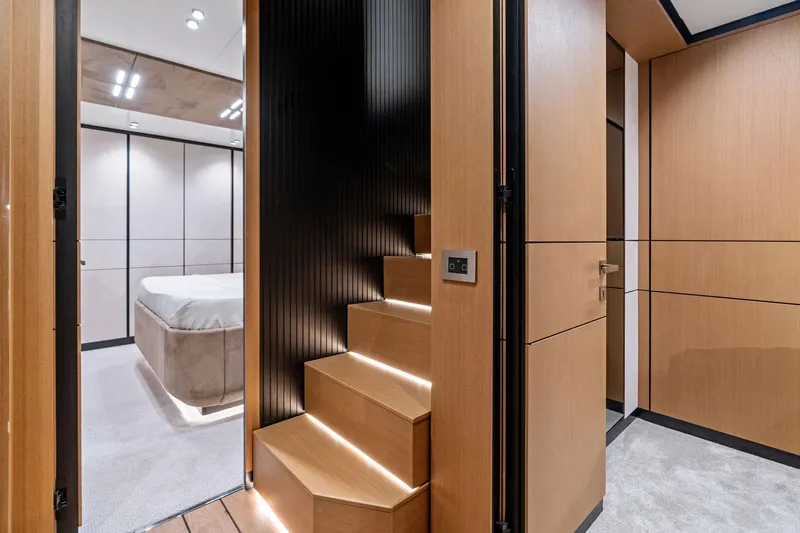 Matzu II Yacht Photos Pics Modern interior of 2023 Wally WHY 150 yacht with sleek wooden stairs and bedroom.