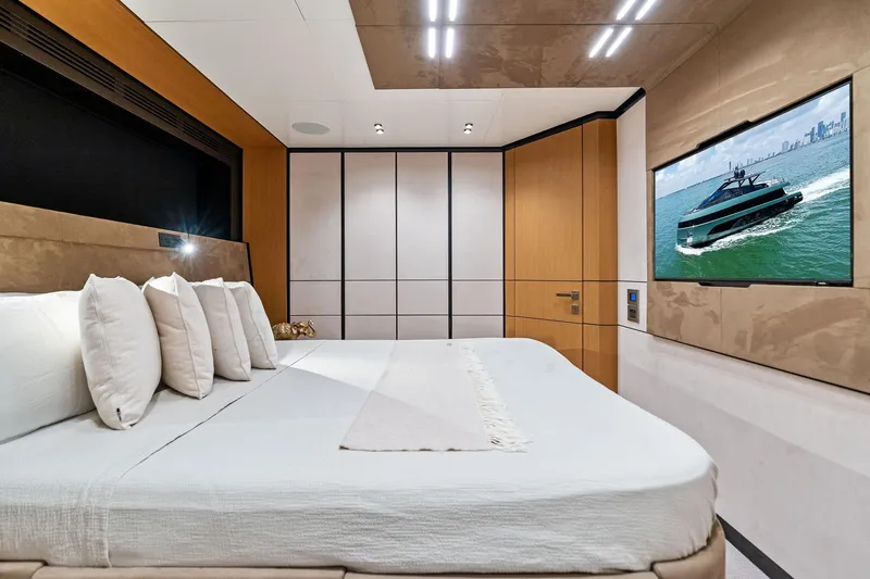 Matzu II Yacht Photos Pics Luxurious bedroom interior on 2023 Wally WHY 150 yacht with modern design and TV display.