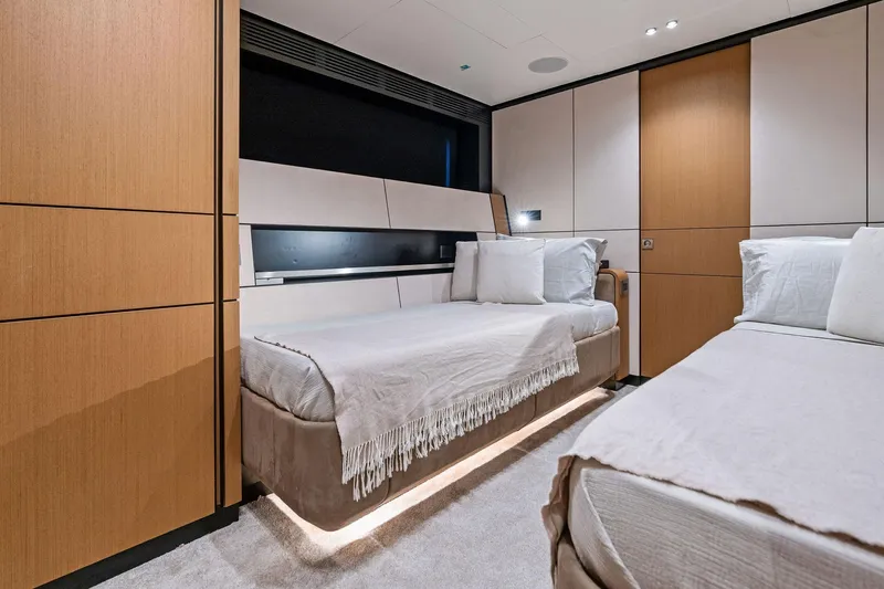 Matzu II Yacht Photos Pics Luxurious interior of 2023 Wally WHY 150 yacht with modern twin beds and elegant decor.
