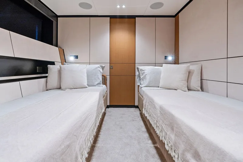 Matzu II Yacht Photos Pics Luxurious twin cabin interior of 2023 Wally WHY 150 yacht, featuring modern design and cozy bedding.