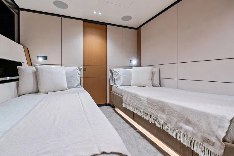 Matzu II Yacht Photos Pics Luxurious twin cabin interior of 2023 Wally WHY 150 yacht, featuring modern design and cozy bedding.