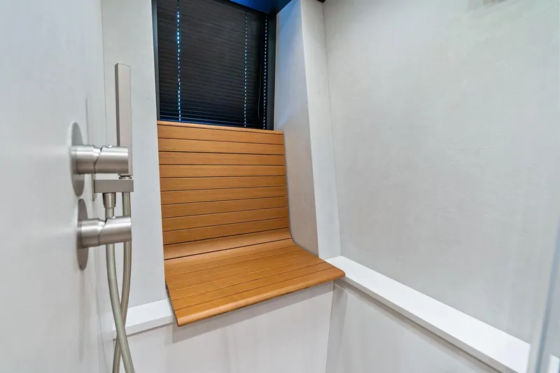 Matzu II Yacht Photos Pics Modern shower with wooden bench and sleek fixtures on Wally WHY 150 yacht, 2023 model.