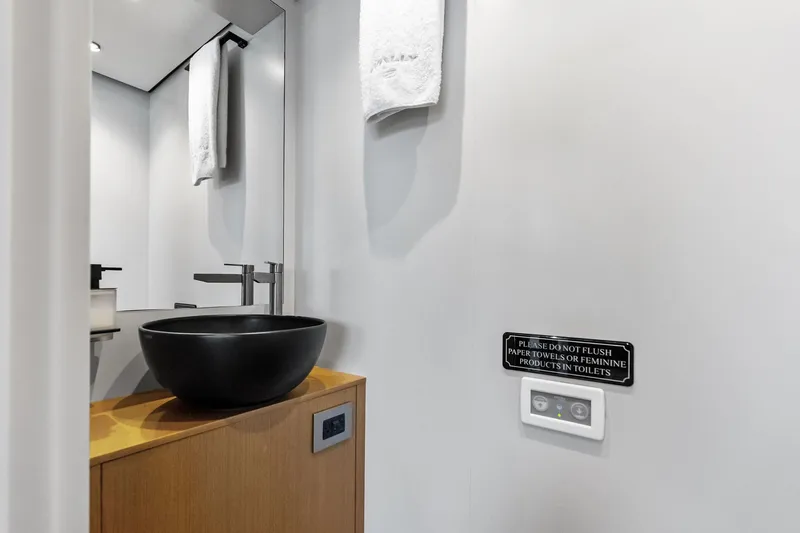 Matzu II Yacht Photos Pics Modern bathroom in 2023 Wally WHY 150 yacht with black basin and towel.