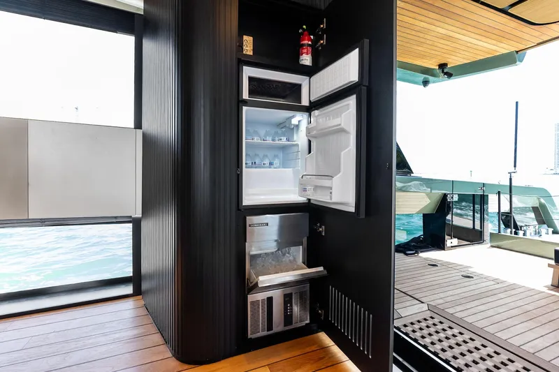 Matzu II Yacht Photos Pics Open refrigerator on Wally WHY 150 yacht, showcasing modern interior design, 2023 model.