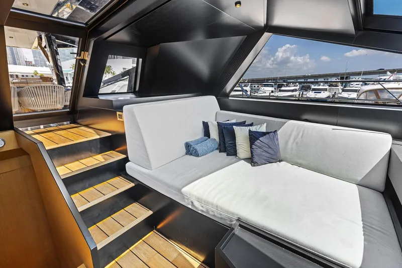 Matzu II Yacht Photos Pics Luxurious interior of 2023 Wally WHY 150 yacht with modern seating and marina view.