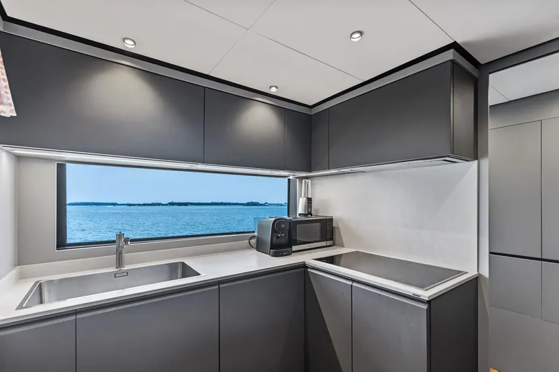 Matzu II Yacht Photos Pics Modern kitchen interior on 2023 Wally WHY 150 yacht with ocean view.